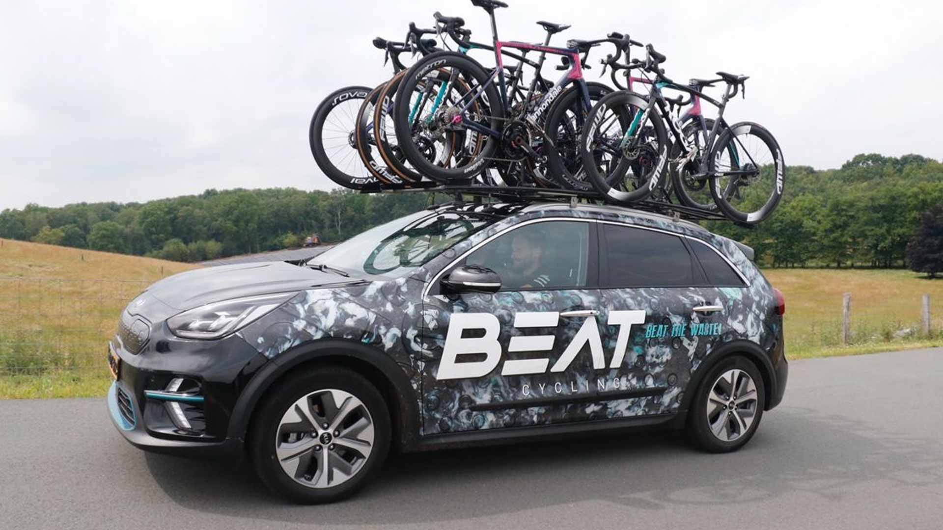 The beat cycling team teamcar with roadbikes on the roof